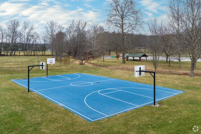Residents make use of the basketball courts in Letty Walter Park.