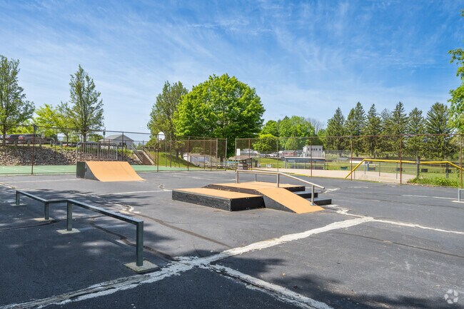 Charlton Community Park's skate park features ramps, rails, and obstacles for all skill levels, welcoming skateboards, scooters, and bikes.