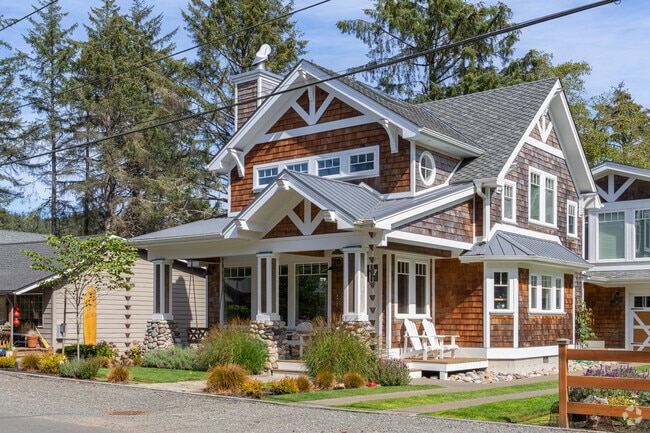 Enjoy the sea breeze from your Craftsman porch in Cannon Beach.