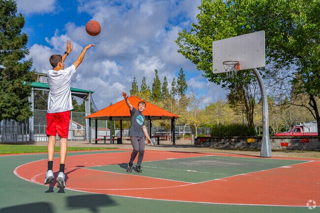 Boys compete one on one at the Maidu Community Basketbal Courts.