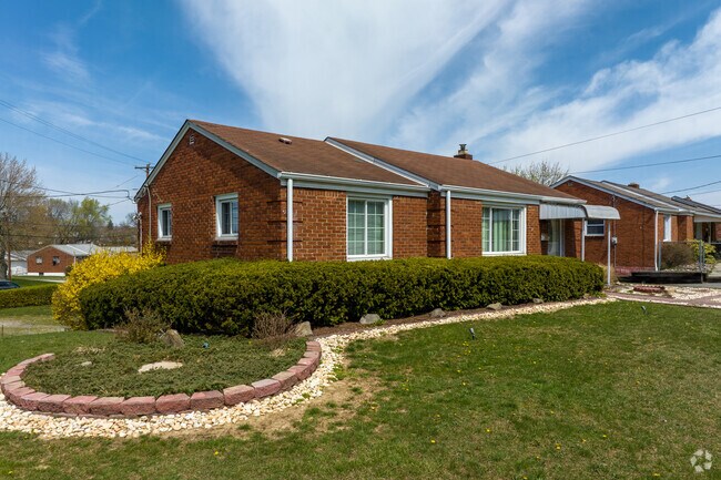 A red brick ranch style home with large yard in the Liberty Borough.