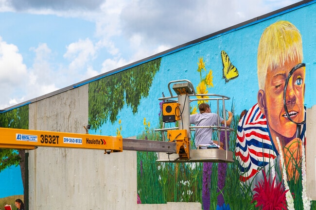 Colorful murals by local artists brighten buildings throughout Noelridge Park.