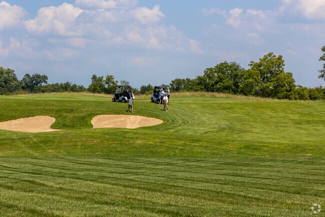 Sand traps and rolling hills frame a sunny round at Hawk’s View Golf Club in Como.