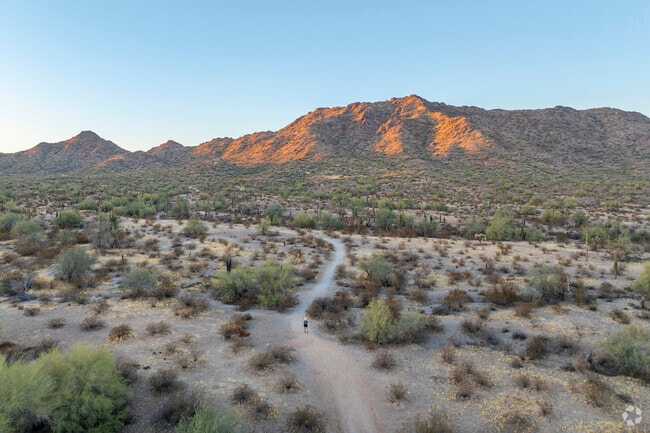 Outdoor enthusiasts from Chandler Heights Citrus explore sanitized multi-use paths in San Tan Mountain Regional Park that wind through rocky outcrops and wide desert plains.