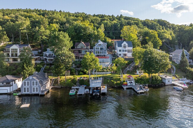 A row of lakeside homes with private docks sits along Lake Sunapee in Newbury, New Hampshire.