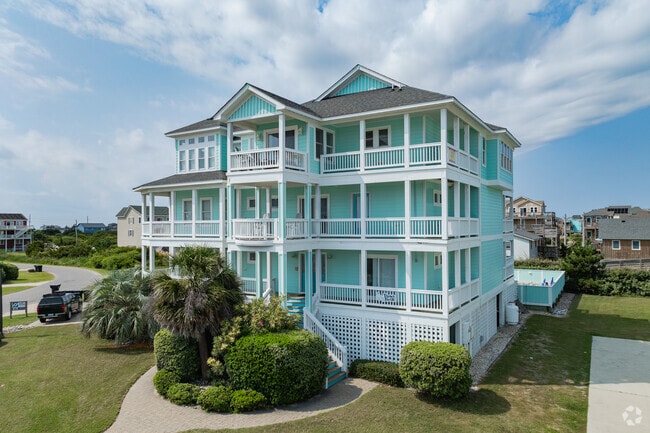Find modern styles of homes with wrap around porches for ocean views.