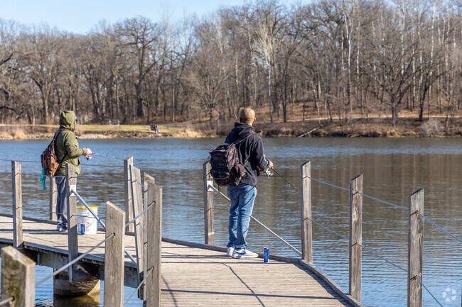 Watrous Heights residents cast lines at nearby Fort Des Moines Park's stocked lake.