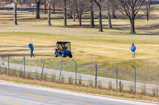 Golfers visit Tulsa Country Club next to Owen Park.