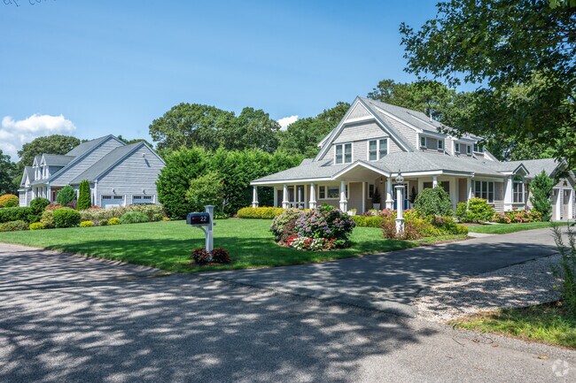 A row of homes line this quiet West Falmouth street.
