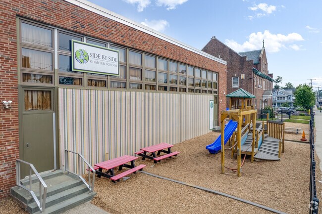 Students enjoy playing on the playground at Side by Side Charter School in Norwalk.