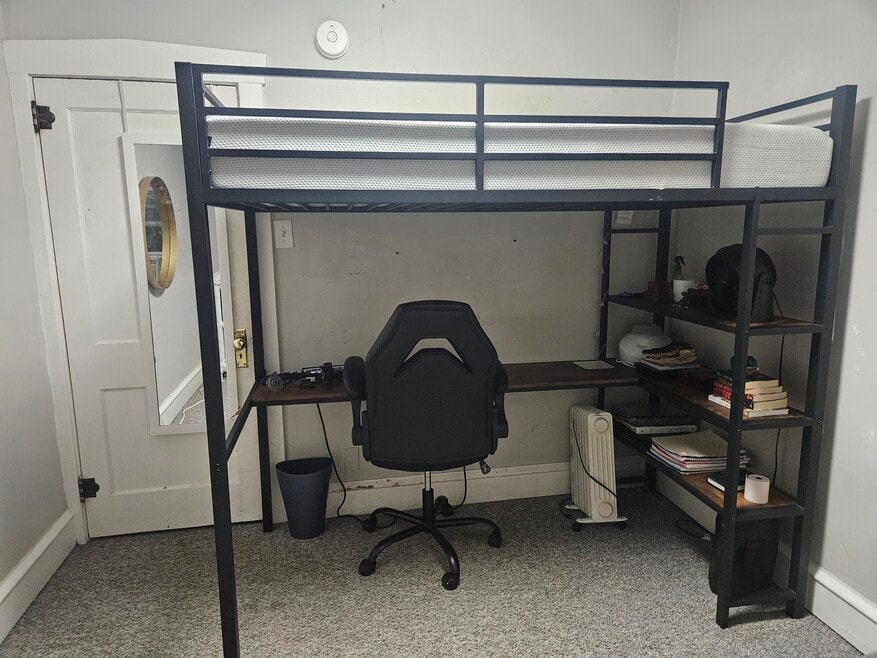 Lofted twin bed with mattress. Built-in desk and shelves + office chair.