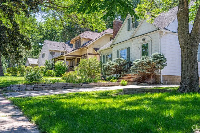 A row of houses line the sidewalk in the folwell neighborhood.