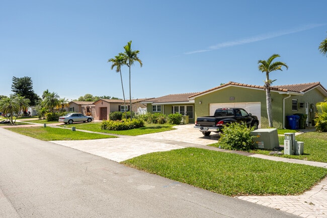 Beautiful homes framed by palm trees are available in Pasadena Lakes.