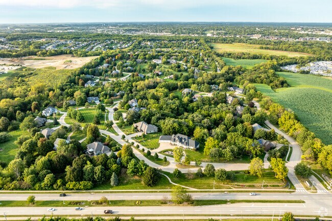 The homes of Walnut Ridge sit on large lots surrounded by green space and mature trees.