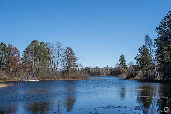 Hayward City Beach offers scenic views of Hayward Lake with calm waters and lush trees.