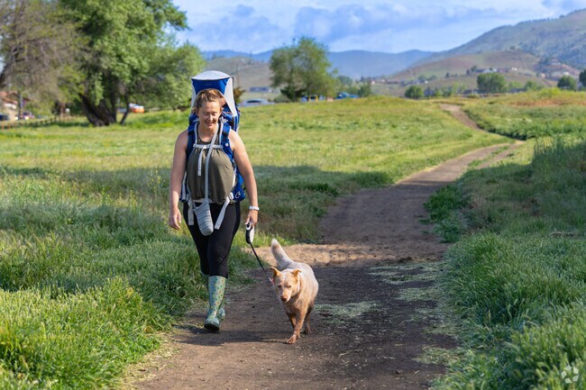A Golden Hills resident carries her young daughter while going on her morning walk.