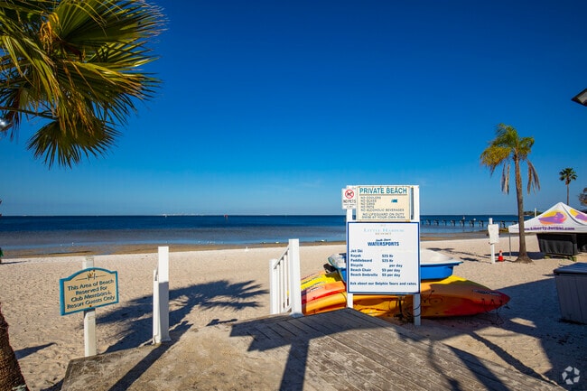 This small boardwalk and signage overlook this private beach.