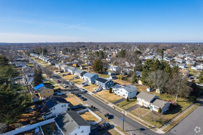 From above, the arrangement of streets and clusters of homes becomes clear, creating a tapestry.