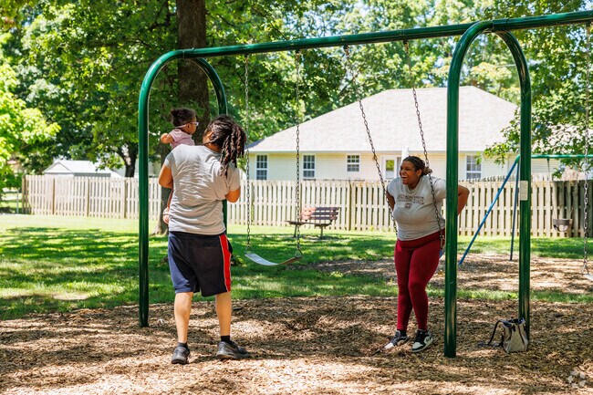 Families enjoy an outing to the Oak Grove Park.