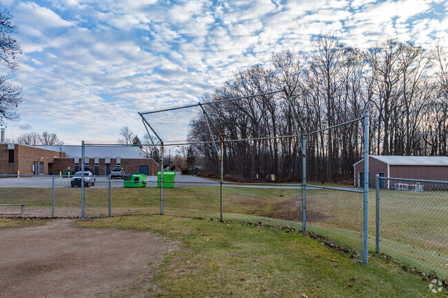 Visit Holland Woods Middle School to watch a local little league baseball game.
