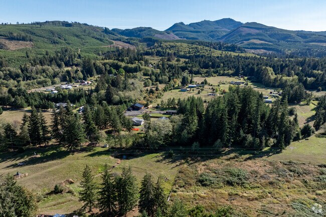 The neighborhood of Svensen near Astoria is enveloped by lush landscapes and mountain vistas.