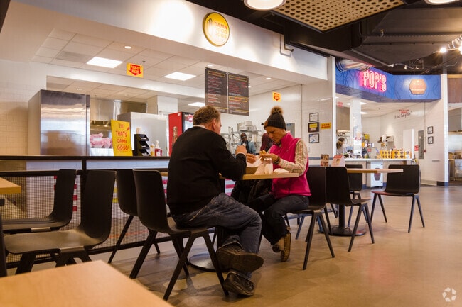 Assembly Full Hall in Greater High Point offers indoor dining with a lively atmosphere.
