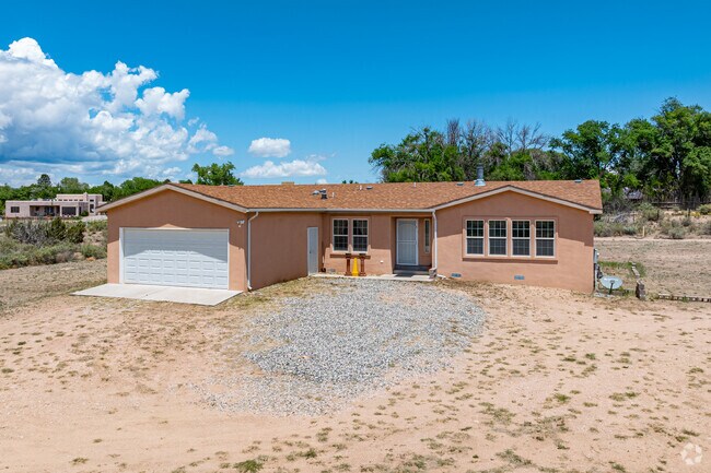 Rural Jacona homes often feature stucco exteriors and kiva fireplaces.
