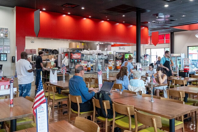 The open kitchen is the heart of the action at Newk's Eatery, near Timbercreek.