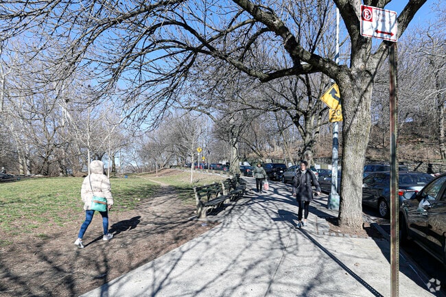 Local Inwood residents walking up the famous hills of the Inwood neighborhood.