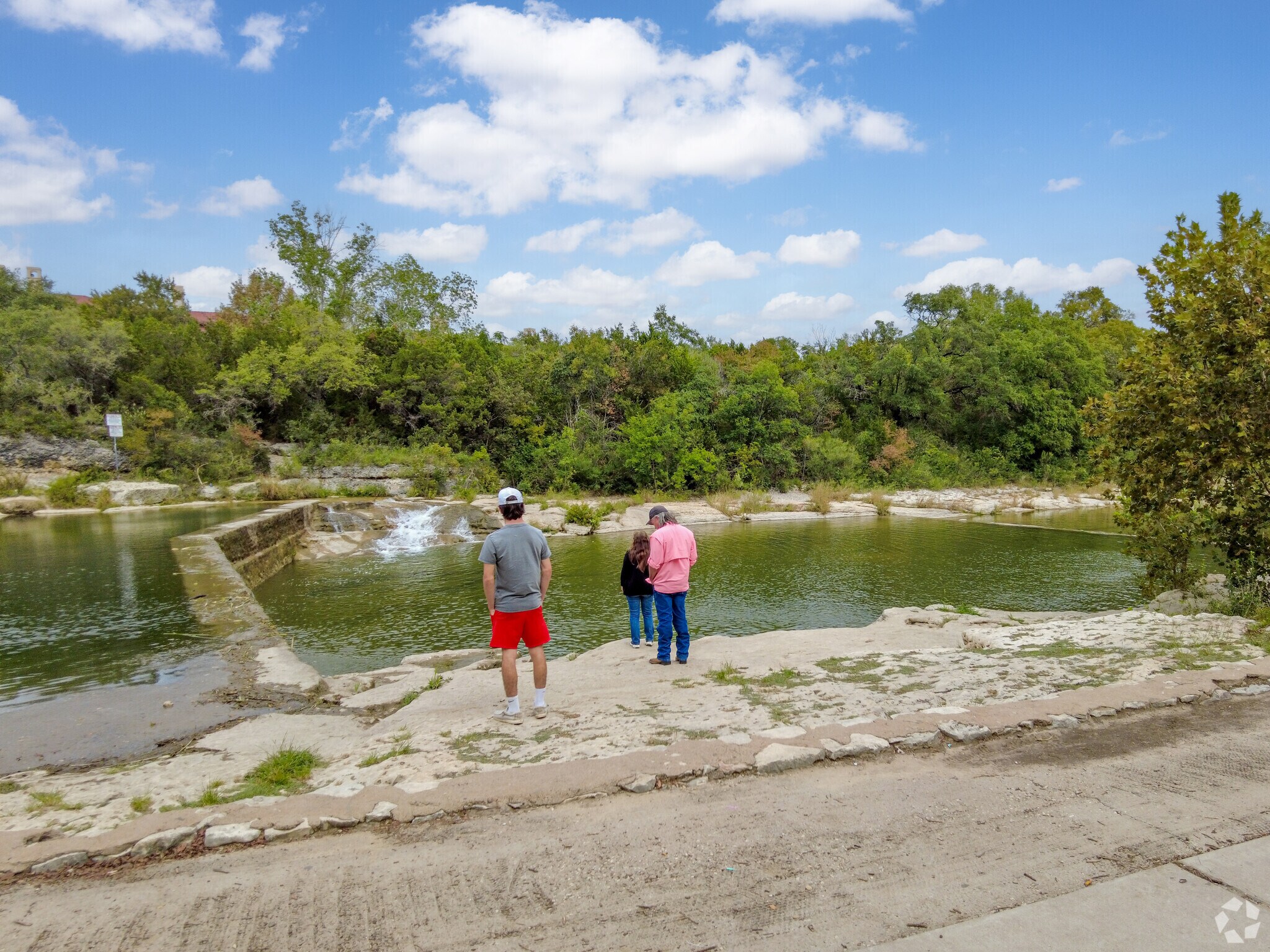People taking in the sites at Blue Hole in River Bend.