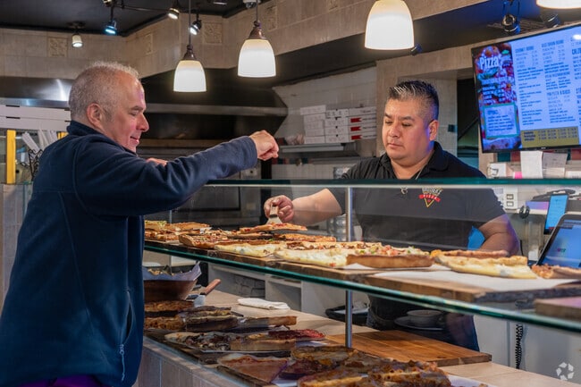 Brothers Pizza offers delicious slices right next to the West Windsor train station.