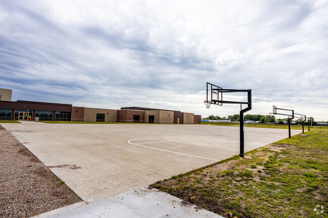 Heritage Elementary School offers a basketball court for recess activities.