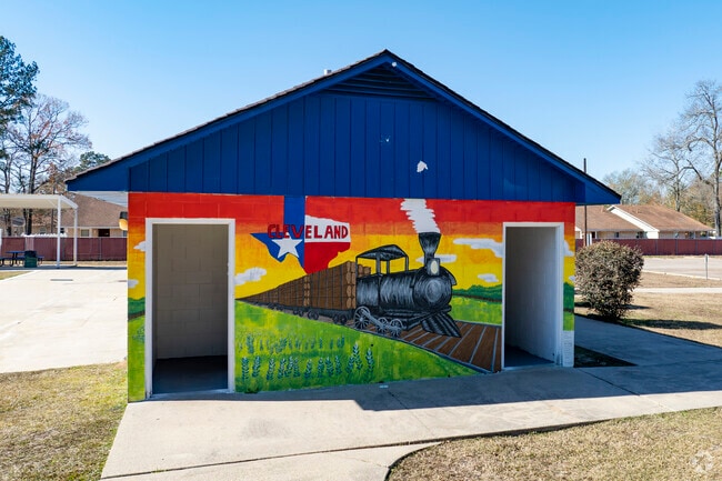 A mural depicting the towns lumber history is painted on a building at Campbell Park.