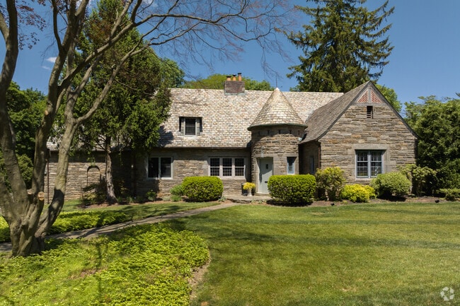 This Tudor inspired stone home sits on a corner lot in Wyncote.