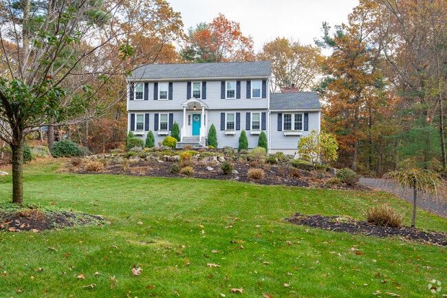 Far West Andover’s wooded streets include houses set high from the roadway.