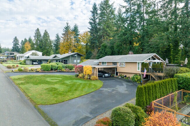Homes in Rosedale sit on lots with shallow front lawns and wooded backyards.