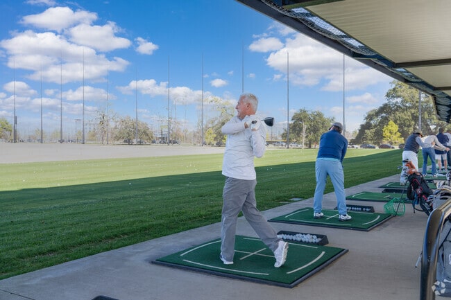 Perfect your swing on the driving range at Memorial Park Golf Course.