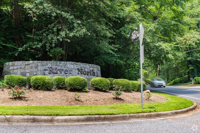 A stone entrance sign marks the welcome into North Riverside, where suburban peace meets access to Sandy Springs’ best amenities.