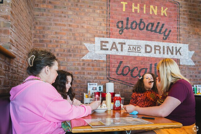 This Kenmore family shares a banana split at Roots Burger Bar.