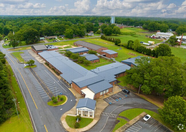 Ruth Hill Elementary School has a large campus with green landscapes.