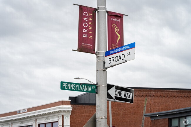 Spot the iconic Broad St. sign in the vibrant Dominican neighborhood of Lower South Providence.
