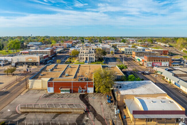 Take in the beauty of Mount Pleasant from above, with the iconic courthouse at the heart of a bustling town full of shops and charm.