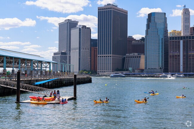 A beautiful city view and kayakers can be enjoyed at Brooklyn Bridge Park Boathouse.
