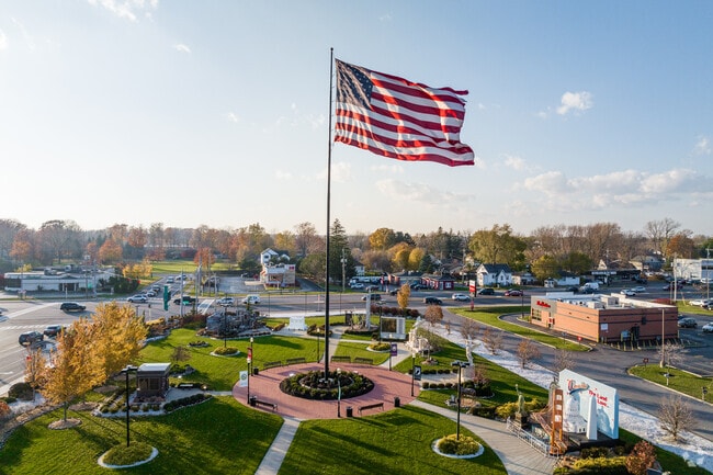 Patriots and Heroes Park is located in Harris Hill and can be seen by its giant American flag.