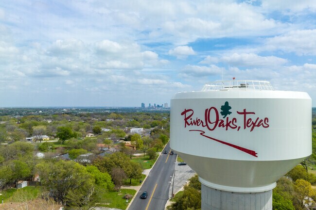 The River Oaks water tower stands tall with downtown Fort Worth in the background.