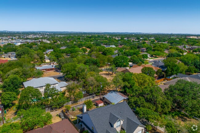 Housing in Leon Valley sits on older plots with mature shade trees.