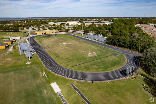 Families watch their children play football and track at Ocoee High School in Orange County.