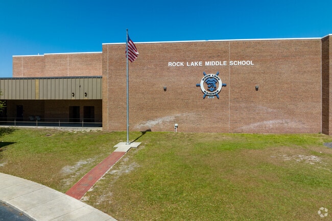 The entrance to Rock Lake Middle School displays their logo and the American Flag.