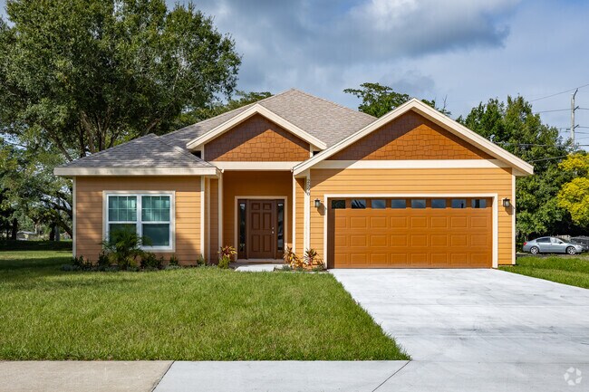 This single-story new construction home in Midway features unique orange accents.