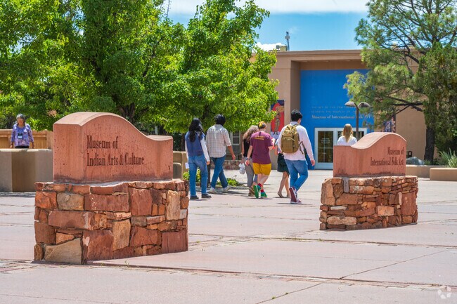 A family walks between the many museums around Museum Plaza.